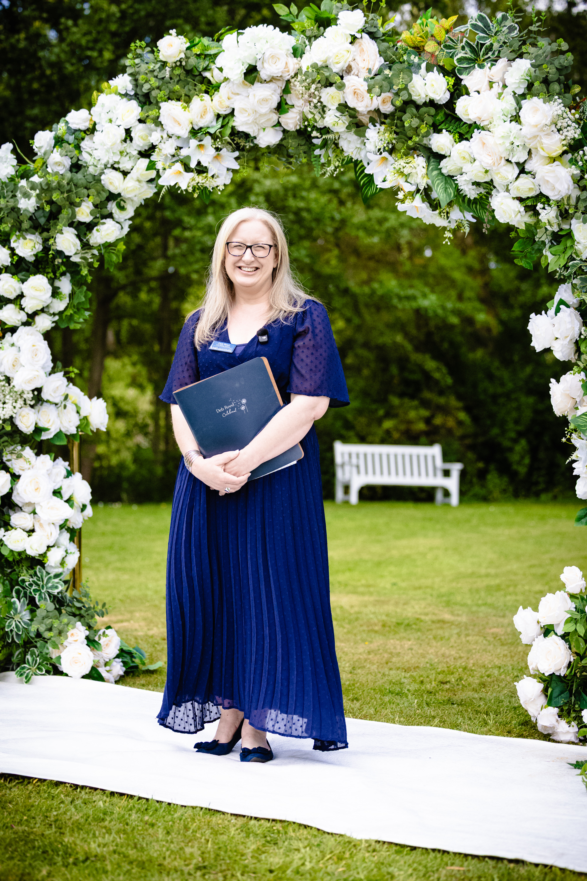 Deb Reed Celebrant based in Colchester Essex sitting smiling before a wedding.